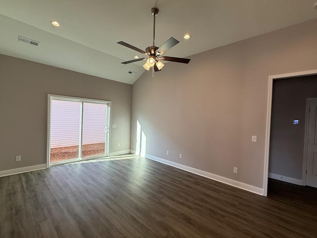 spare room with dark wood-style floors, visible vents, ceiling fan, and baseboards