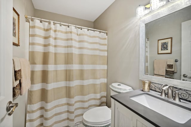 full bath with a shower with shower curtain, toilet, and vanity