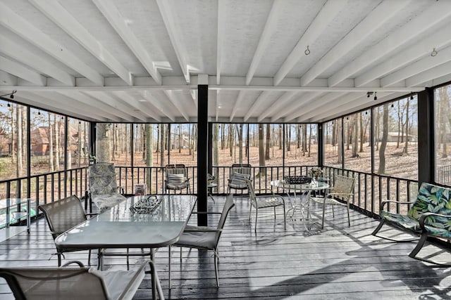 wooden deck featuring outdoor dining space