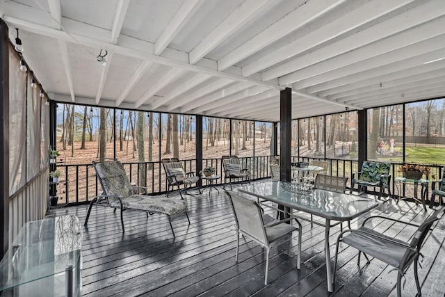 sunroom with outdoor dining space