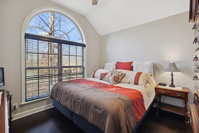 bedroom with ceiling fan, wood finished floors, lofted ceiling, and baseboards