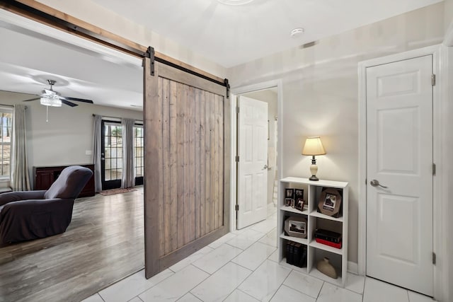 interior space featuring a barn door