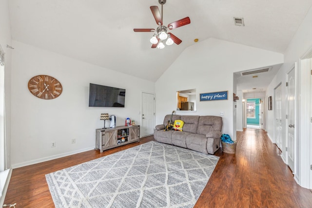 living area with a ceiling fan, high vaulted ceiling, wood finished floors, and visible vents