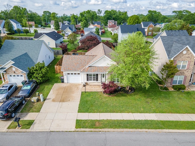 birds eye view of property with a residential view