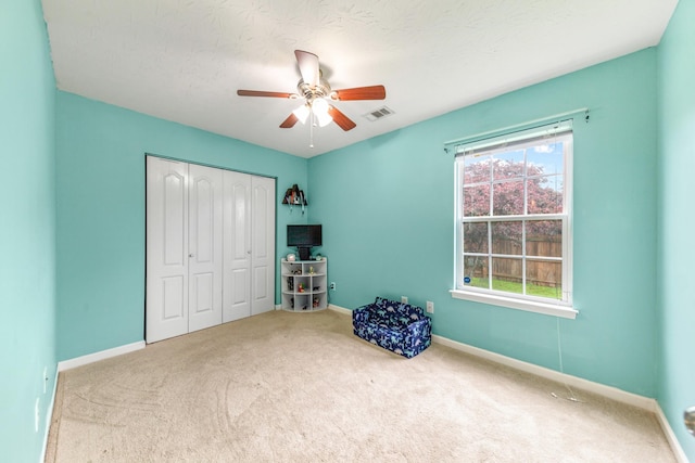 unfurnished bedroom featuring a closet, visible vents, carpet, and baseboards