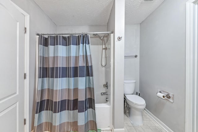 bathroom with shower / bath combo, tile patterned floors, toilet, baseboards, and a textured ceiling