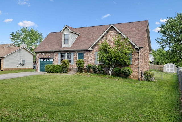 cape cod-style house featuring brick siding, a garage, a front lawn, and fence