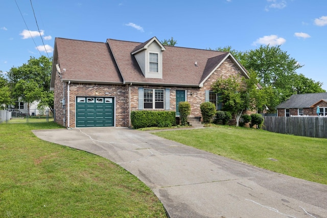 view of front of property with brick siding, fence, and a front yard