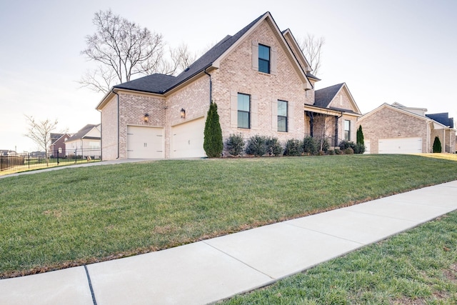 view of front facade featuring fence, a front lawn, brick siding, and a garage