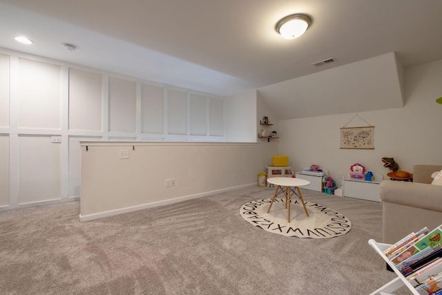 playroom featuring lofted ceiling, visible vents, baseboards, and carpet floors
