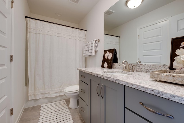 full bathroom featuring toilet, tile patterned floors, visible vents, and vanity