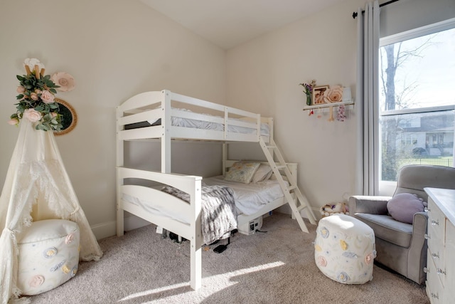 carpeted bedroom with baseboards