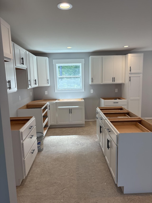 116 Carter Blake Rd, Tullahoma, TN 37388 - kitchen with white cabinetry, recessed lighting, and baseboards