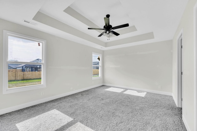 346 Galway Dr, Clarksville, TN 37042 - spare room featuring a tray ceiling, carpet, baseboards, and a ceiling fan
