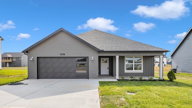 346 Galway Dr, Clarksville, TN 37042 - view of front facade featuring a garage, driveway, a front yard, a shingled roof, and board and batten siding