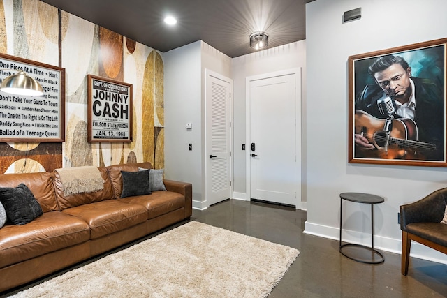 living room with baseboards, recessed lighting, and concrete floors