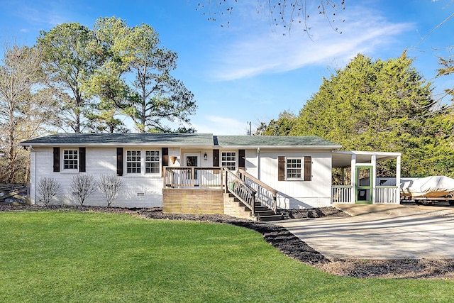 ranch-style house with a front lawn, crawl space, concrete driveway, and brick siding