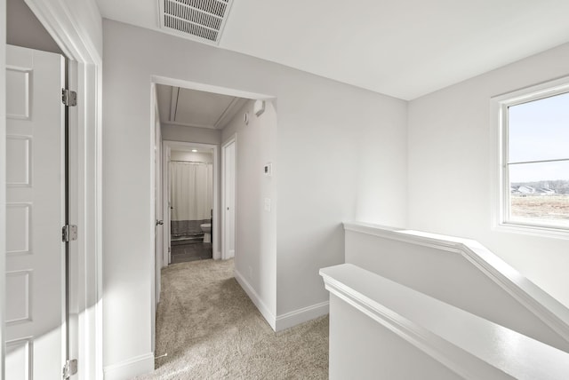 227 Donegal Dr, Clarksville, TN 37042 - hallway featuring an upstairs landing, light colored carpet, visible vents, baseboards, and attic access