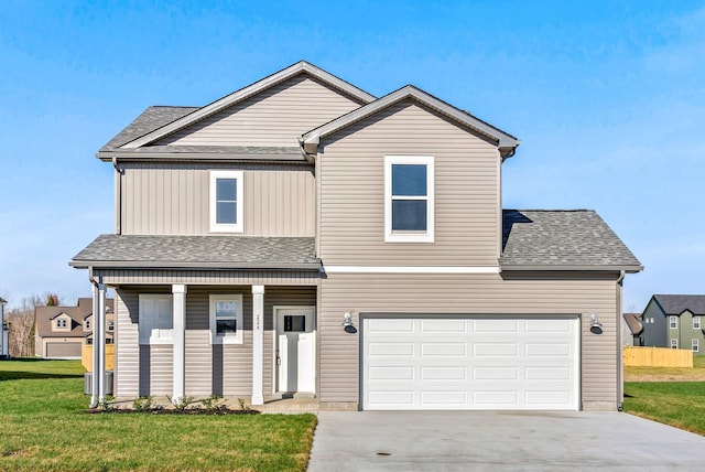 227 Donegal Dr, Clarksville, TN 37042 - traditional home with a porch, roof with shingles, a front lawn, concrete driveway, and an attached garage