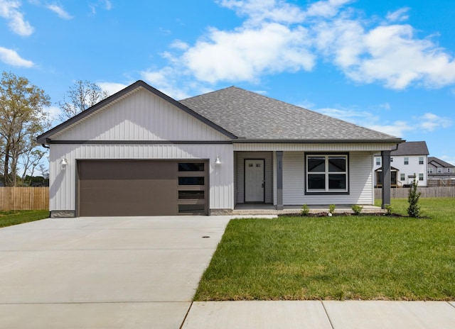 235 Donegal Dr, Clarksville, TN 37042 - view of front facade with a shingled roof, a front yard, an attached garage, fence, and a porch