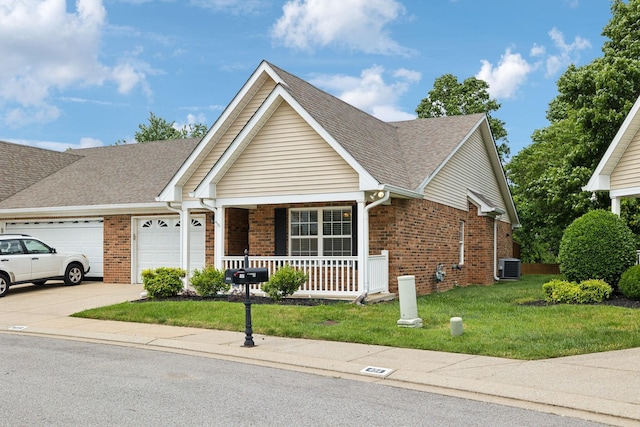 502 Village Green Cir, Murfreesboro, TN 37128 - view of front of house with covered porch, brick siding, cooling unit, and a front lawn