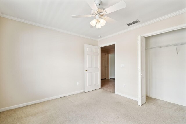 502 Village Green Cir, Murfreesboro, TN 37128 - unfurnished bedroom with ornamental molding, light colored carpet, a closet, baseboards, and a ceiling fan