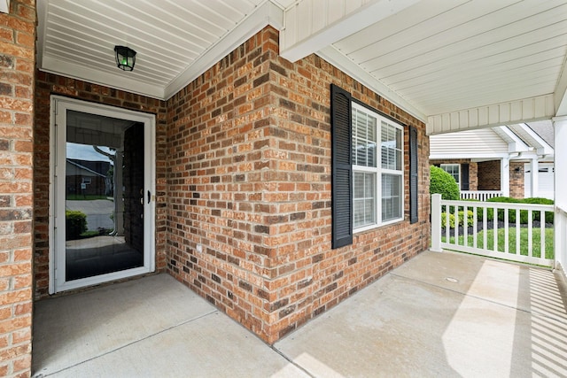 502 Village Green Cir, Murfreesboro, TN 37128 - view of exterior entry with covered porch and brick siding