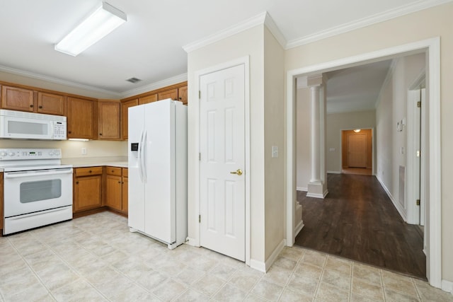 502 Village Green Cir, Murfreesboro, TN 37128 - kitchen with white appliances, decorative columns, crown molding, light countertops, and brown cabinets