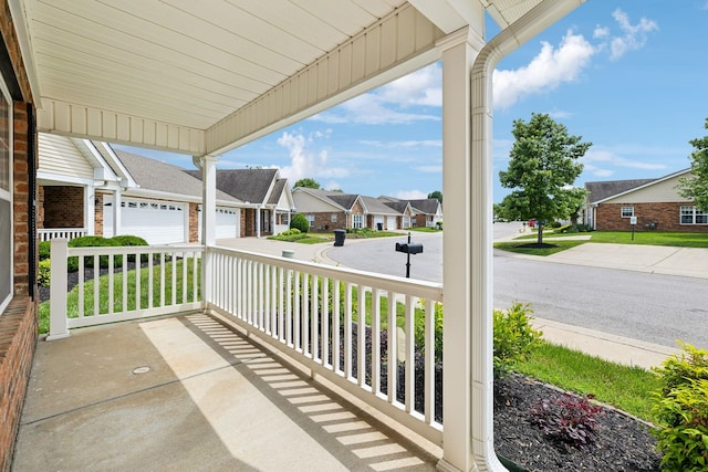 502 Village Green Cir, Murfreesboro, TN 37128 - view of patio / terrace with a residential view, a garage, covered porch, and concrete driveway
