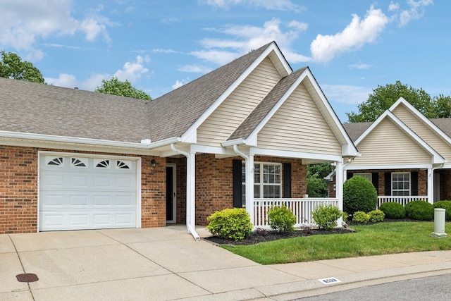 502 Village Green Cir, Murfreesboro, TN 37128 - view of front of property with a porch, brick siding, an attached garage, concrete driveway, and roof with shingles