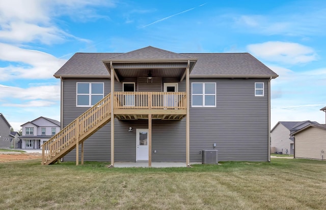 211 Donegal Dr, Clarksville, TN 37042 - back of house featuring a lawn, stairs, and roof with shingles