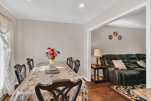 dining space featuring recessed lighting, dark wood finished floors, and baseboards