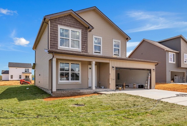 215 Donegal Dr, Clarksville, TN 37042 - traditional-style house with covered porch, concrete driveway, a front yard, and a garage