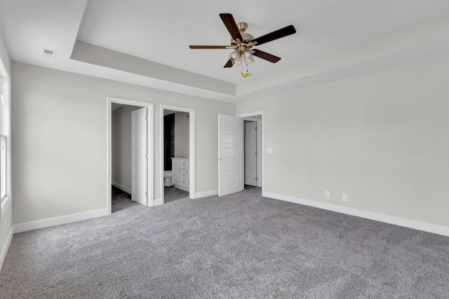 215 Donegal Dr, Clarksville, TN 37042 - unfurnished bedroom featuring carpet flooring, visible vents, ceiling fan, a tray ceiling, and baseboards