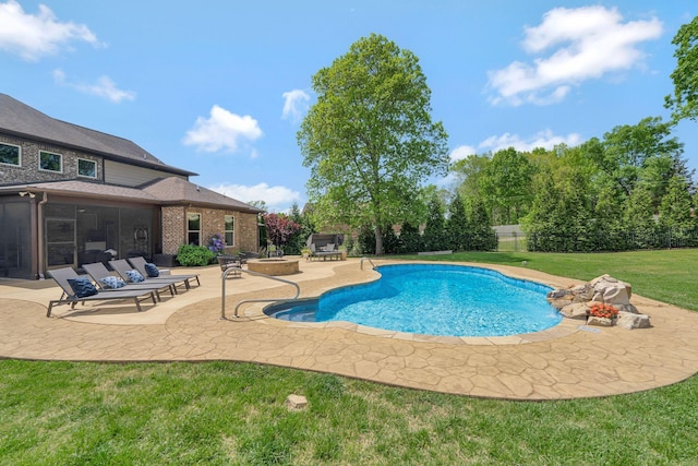 view of pool featuring a patio, a fenced in pool, a sunroom, a lawn, and a fenced backyard