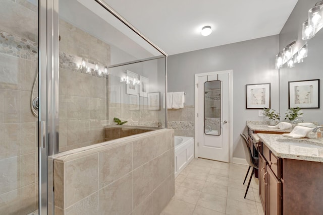 bathroom featuring a sink, a bath, a stall shower, double vanity, and tile patterned flooring