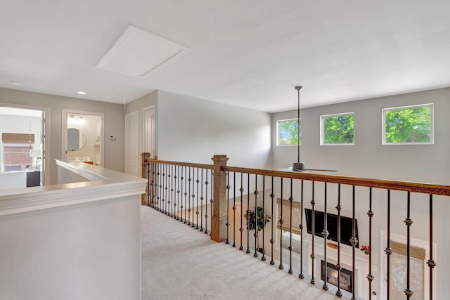hall with recessed lighting and carpet flooring