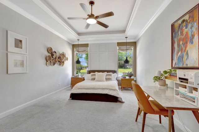 bedroom featuring a raised ceiling, crown molding, carpet flooring, and baseboards