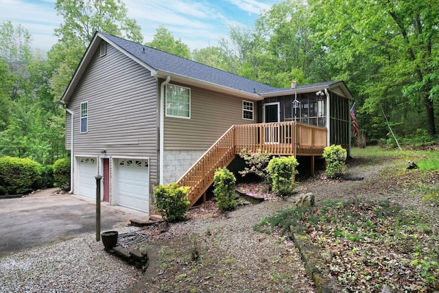 100 Treeann Ln, Ringgold, GA 30736 - exterior space featuring stairway, a garage, a wooden deck, driveway, and a sunroom