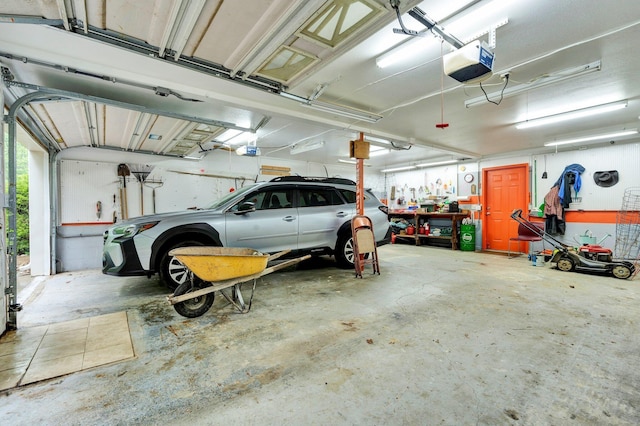 100 Treeann Ln, Ringgold, GA 30736 - garage featuring a workshop area and a garage door opener