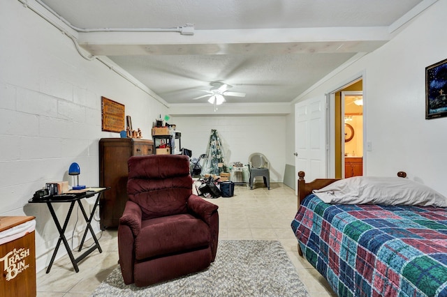 100 Treeann Ln, Ringgold, GA 30736 - bedroom with light tile patterned floors, concrete block wall, ensuite bath, and a textured ceiling