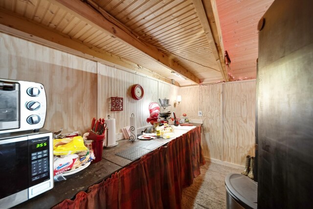 1308 Neelys Bend Rd, Madison, TN 37115 - bar featuring wooden walls, beamed ceiling, and carpet floors