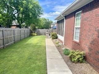 view of yard with a fenced backyard