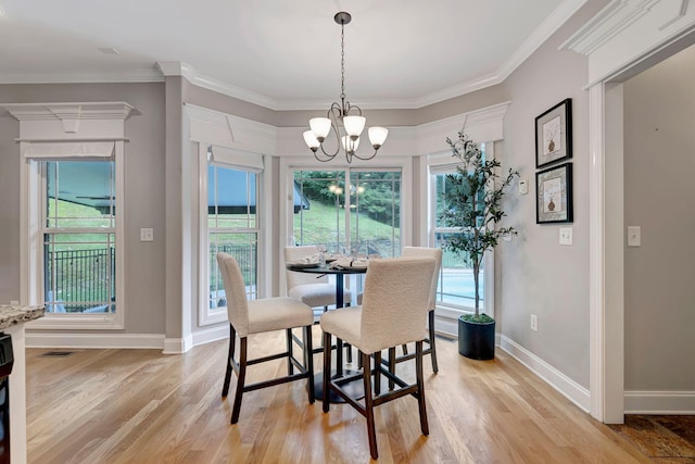 1199 Ben Hill Blvd, Nolensville, TN 37135 - dining space featuring a chandelier, light wood finished floors, and ornamental molding
