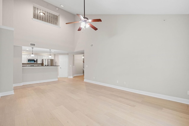 3201 Aspen Grove Dr Unit L8, Franklin, TN 37067 - unfurnished living room with a ceiling fan, baseboards, visible vents, and light wood-type flooring