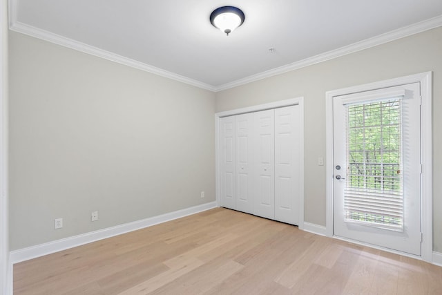 3201 Aspen Grove Dr Unit L8, Franklin, TN 37067 - unfurnished bedroom with baseboards, ornamental molding, and light wood-style flooring