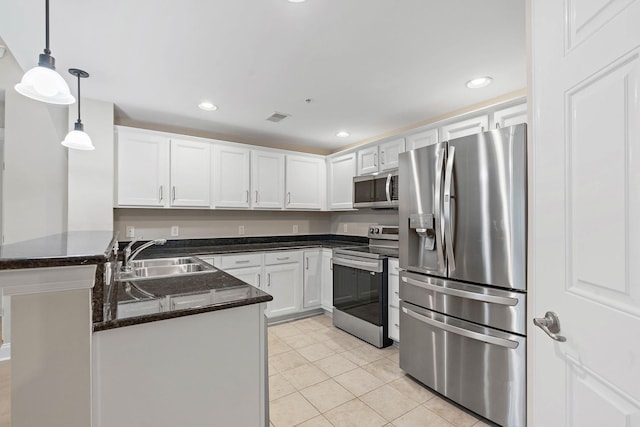 3201 Aspen Grove Dr Unit L8, Franklin, TN 37067 - kitchen featuring visible vents, appliances with stainless steel finishes, a sink, a peninsula, and white cabinetry