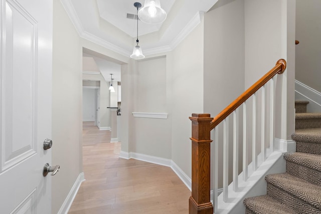 3201 Aspen Grove Dr Unit L8, Franklin, TN 37067 - stairs with visible vents, a raised ceiling, crown molding, and wood finished floors