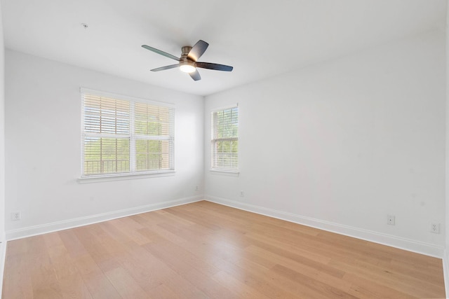3201 Aspen Grove Dr Unit L8, Franklin, TN 37067 - spare room with baseboards, a ceiling fan, and light wood-style flooring