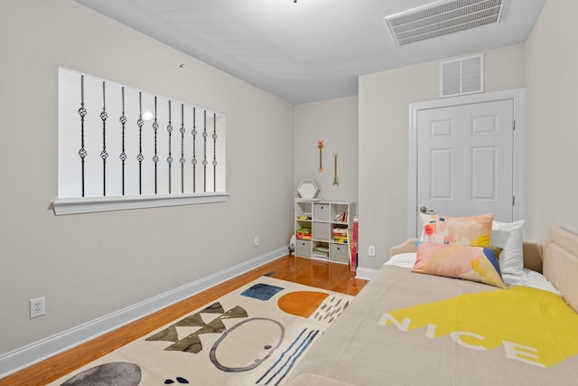 3201 Aspen Grove Dr Unit L8, Franklin, TN 37067 - bedroom with baseboards, visible vents, and wood finished floors